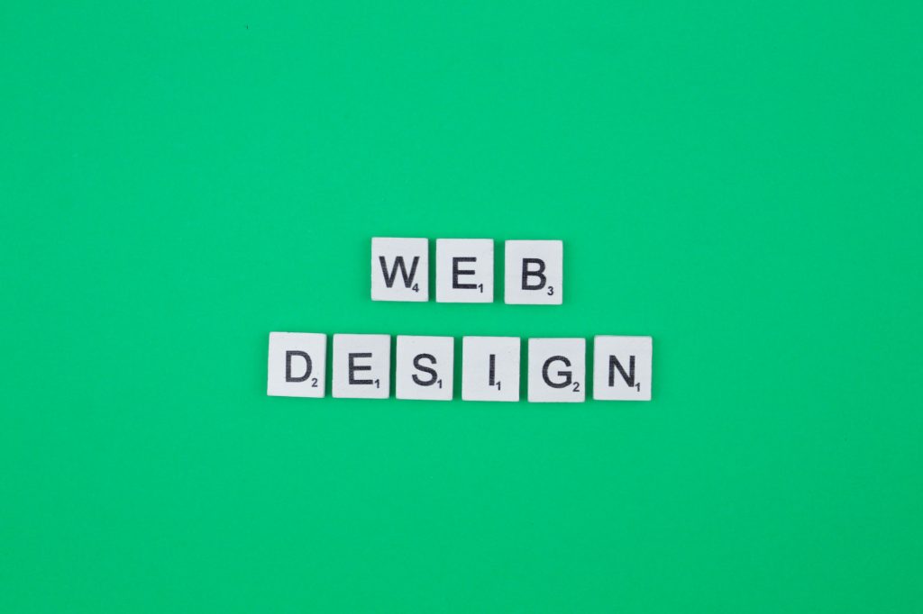 Web design scrabble letters word on a green background